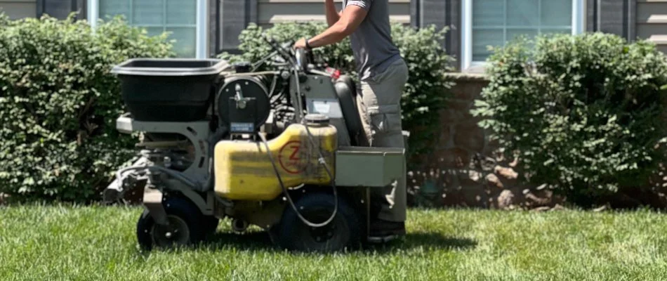 Crew applying a fertilizer treatment on a lawn in Telford, PA.