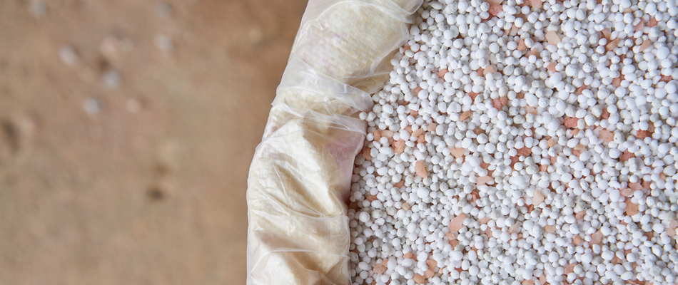 A bag of white and tan colored granular fertilizer ready to be used on a property in Blue Bell, PA. 