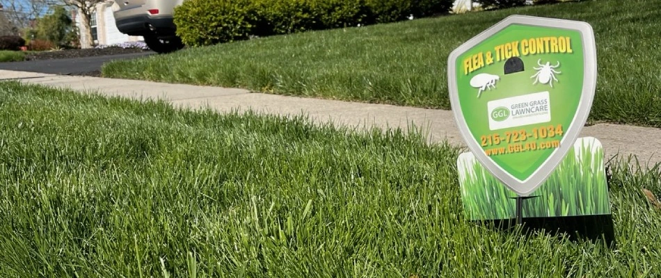 Flea and tick control signage placed on client's lawn in Telford, PA.