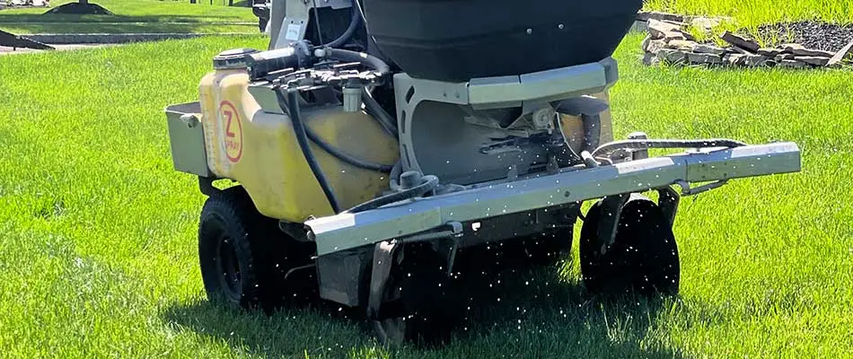 Spreader with fertilizer being in use in Bensalem, PA.